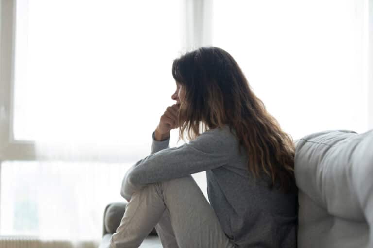 Woman looking out window