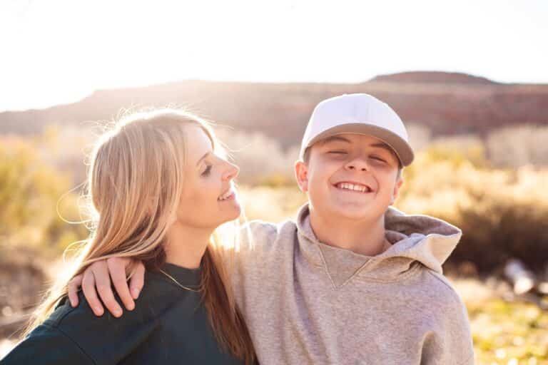 Mother and teen son smiling