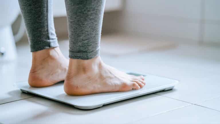 Feet standing on scale