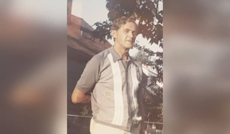 Vintage photo of middle aged man mid-conversation