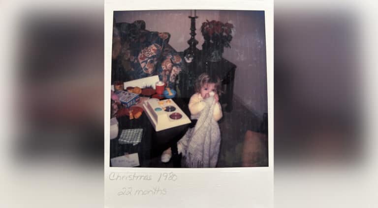 Vintage Polaroid photo of little girl at Christmas