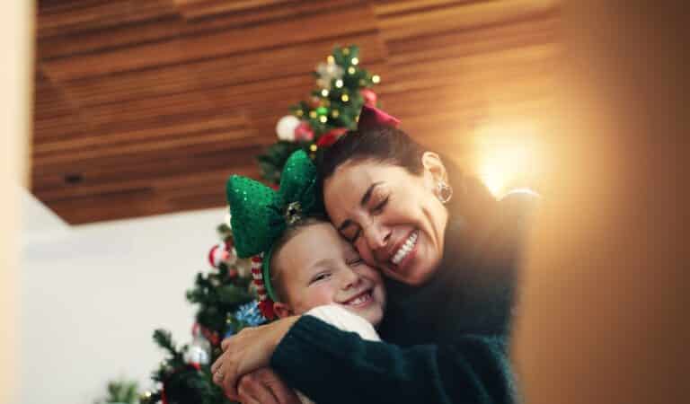Woman hugging child at Christmas