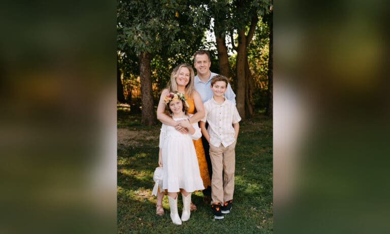 Family of 4 posing for photo