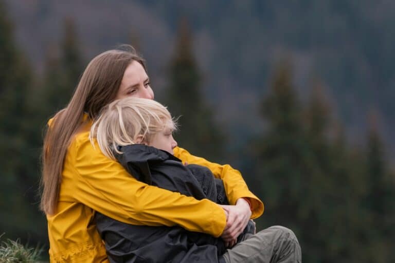 Woman hugging child