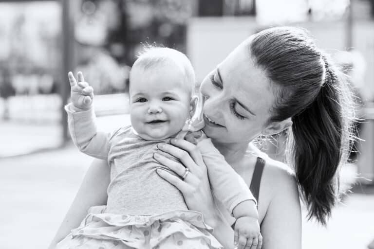 Mother and baby smiling