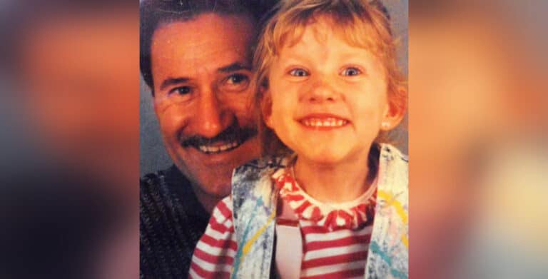 Vintage photo of father and young daughter smiling