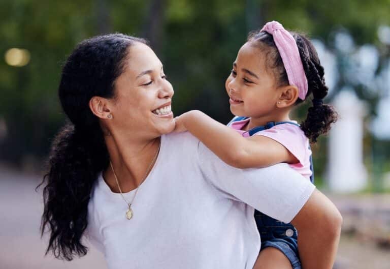 Mother and daughter smiling at each other