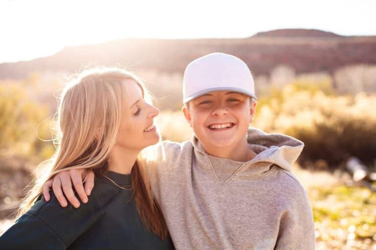 Mother and teen son smiling