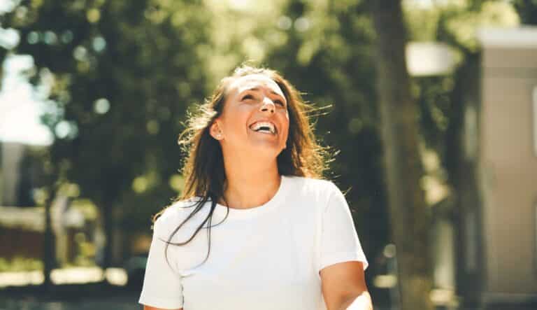 Woman smiling at sun