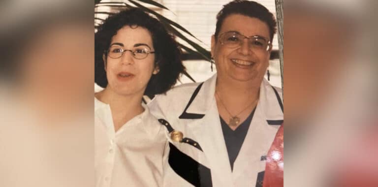 Woman with mother smiling in older photo