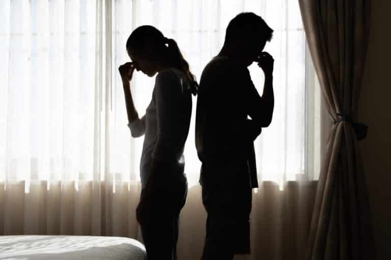 Couple with backs to each other