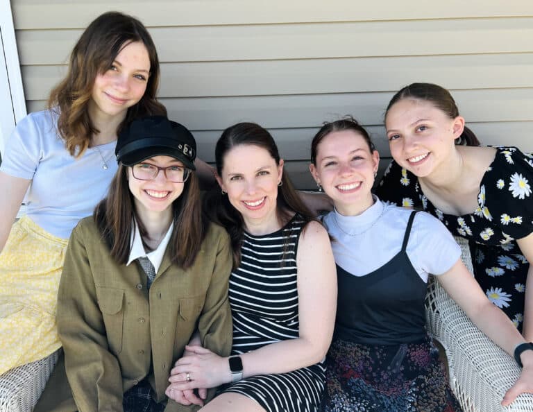 Family of five smiling