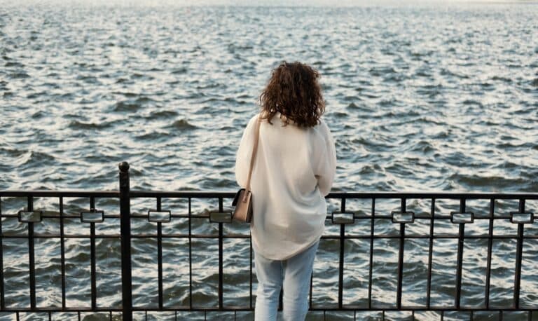 Woman standing over water