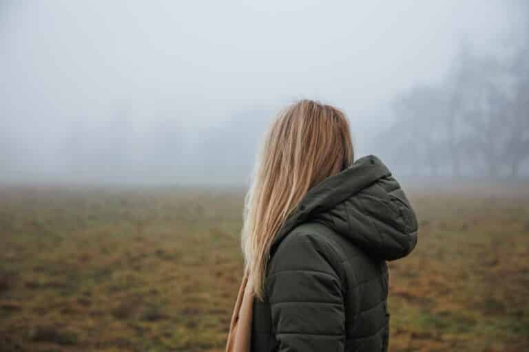 Woman looking off to the fog