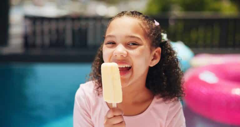 Girl holding popsicle